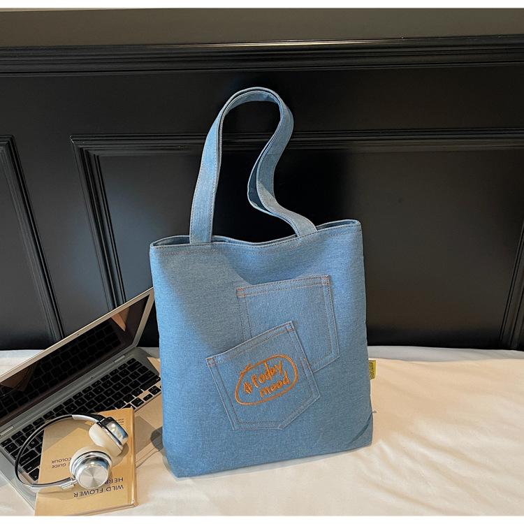 

2025 Summer Simple Niche Design Handheld Casual Shoulder Bag Foreign Simple Cloth Bag Fashionable Personalized Tote Bag світло-синій колір