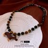 Cartoon Puppy Tiger Eye Necklace: Korean Retro Versatile Sweater Chain High-End Jewelry for Women