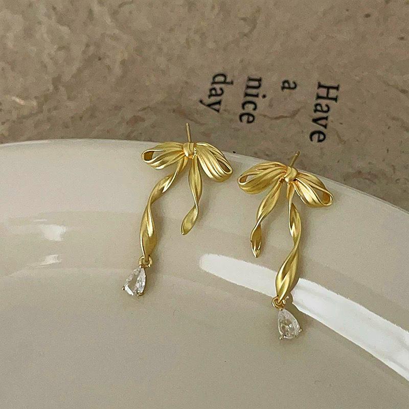 

Popular ballet style bow without ear holes, mosquito coil disc earrings, fashion earrings, personalized ear clips, light luxury and high-end sense