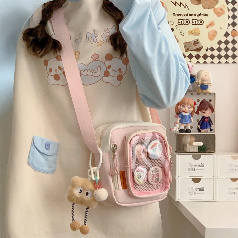 

Japanese girl ins transparent pain bag, small food, shoulder messenger bag, women s versatile casual mobile phone small bag single bag plus badge розовый