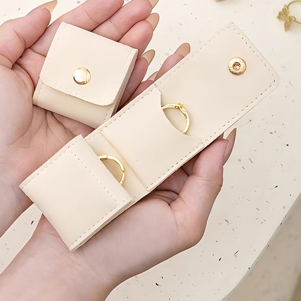 Compact Travel Jewelry Organizer Bag with Secure Button Closure Separate Compartments for Rings Earrings Necklaces