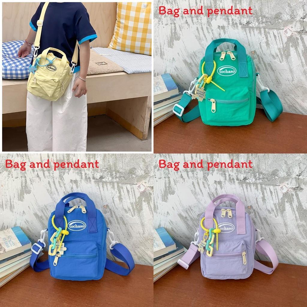 Simple Solid Color Letter Printed Children Single Shoulder Bag With Pendant For Kids School Day Use
