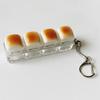 Push Button Anti-Stress Toy "Caramel Bread" Backpack Hanger, Plastic Finger Prank Office Toy