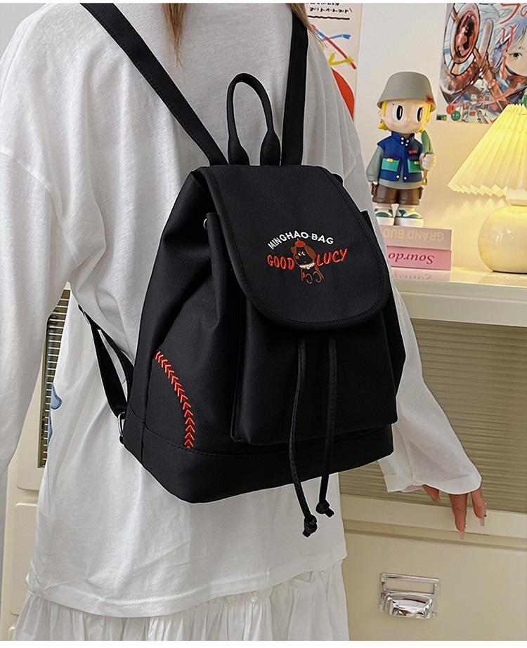 Japanese Student Casual Backpack with Embroidered Puppy Design, Drawstring Closure, and Matching Small Bag for Daily Use.