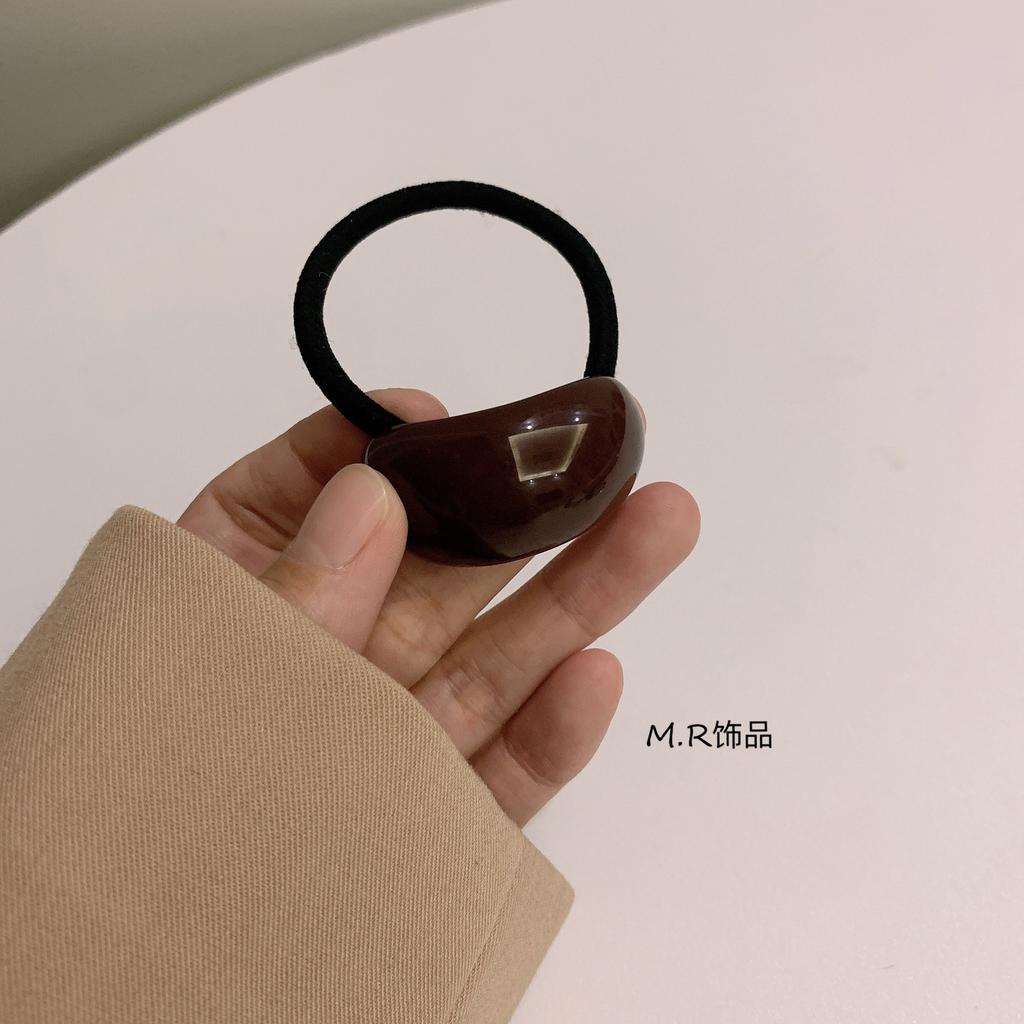 Ein schlichter und eleganter, kalter Stil Acryl-Bogenförmiger Lederband-Kopfschmuck für Damen