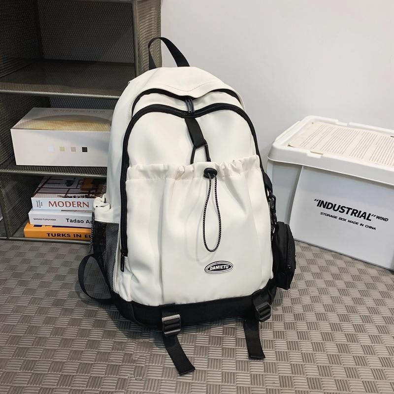 Backpack simple and fashionable college student junior high school student schoolbag female nylon large capacity leisure travel backpack male