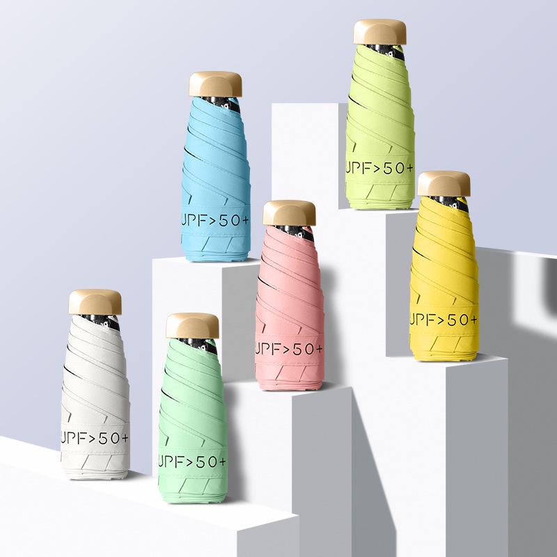 Compact Dual-Use Umbrella: Ultra-Light, Black Glue Sun Protection, Pocket-Sized, Portable, Mini Five-Fold Umbrella for Rain or Shine.