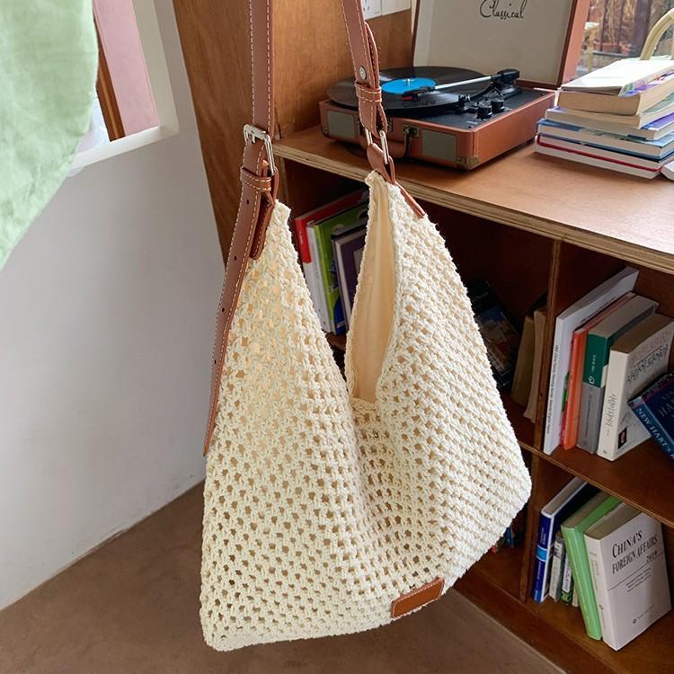 Seaside vacation beach bag weaving 2025 new fashion versatile hollow knitted bag large capacity shoulder armpit bag