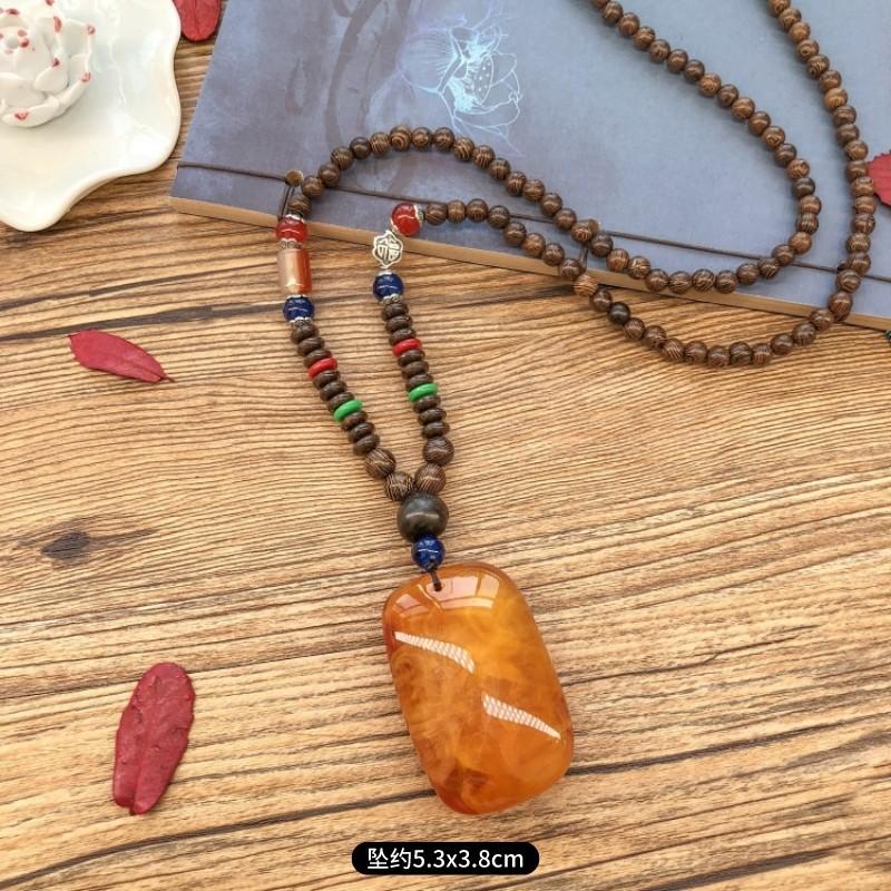 Retro chicken wing wood second generation old beeswax necklace men and women versatile amber pendant long sweater chain pendant