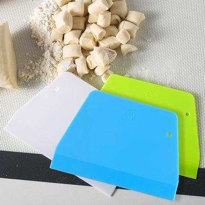 Cuchillo trapezoidal de plástico para raspar masa y aceite