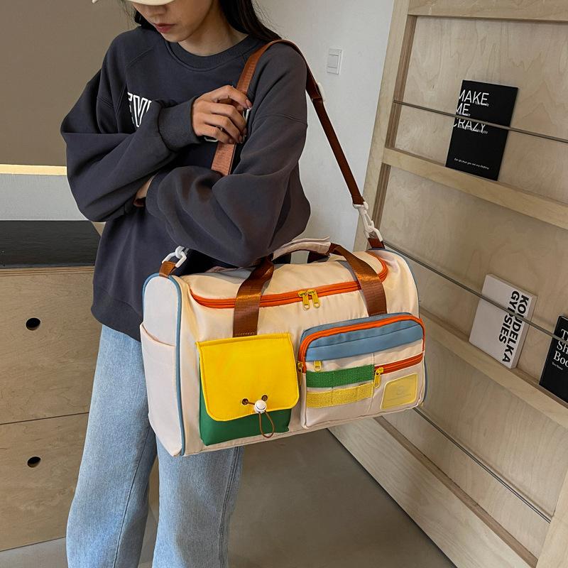 Contrasting color messenger sports fitness bag large-capacity travel hand luggage bag fashion going out short business trip travel bag