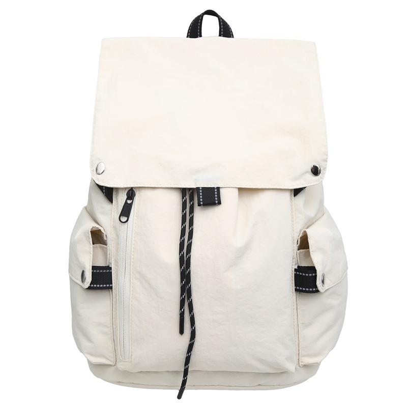 2025 new Korean niche casual simple style solid color backpack women's commuting versatile large-capacity student schoolbag