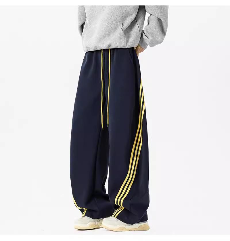 Pánské tmavě modré široké tepláky se třemi pruhy - Ležérní jarní high street trend