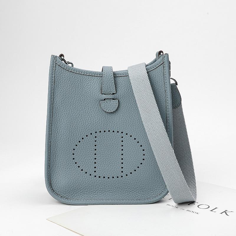 Factory wholesale first layer togo cowhide bucket bag women's bag lychee pattern hollow single shoulder crossbody bag hollow design