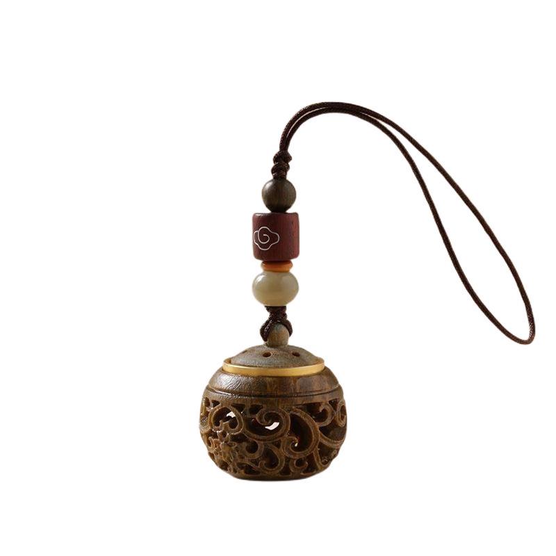 Green Sandalwood Hollow Mobile Phone Chain: Exquisite Aromatherapy Sachet Ball and Tibetan Incense Pendant Keychain in Ancient Style.