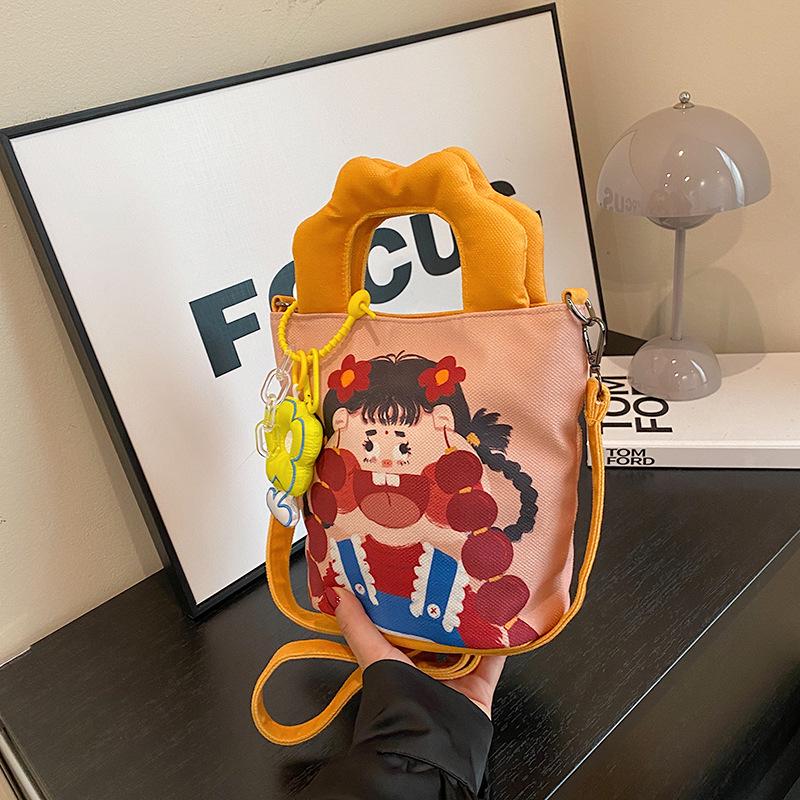2025 Grenzüberschreitende Cartoon-Graffiti-Handtasche: Nischendesign Bucket Schulter- & Umhängetasche für Damen