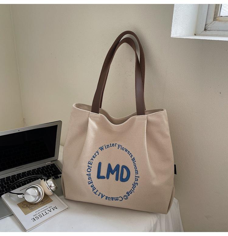 

ins cream color simple versatile canvas bag niche large capacity shoulder bag student daily leisure tote bag
