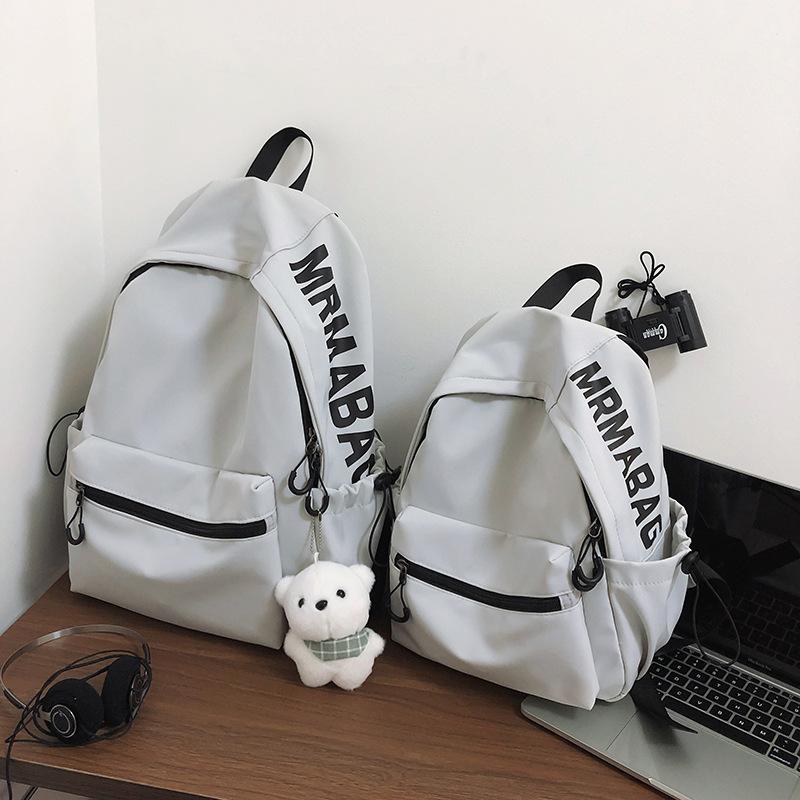 

Lightweight solid color small backpack female Korean version girl small schoolbag female large capacity junior high school student college student Small синій