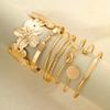 Elegante Vintage Hohllinien-Streifenblumen-Drehmetall-Armreif-Armband-Sets für Damen Tägliches Tragen Party Hochzeit Urlaub Schmuck