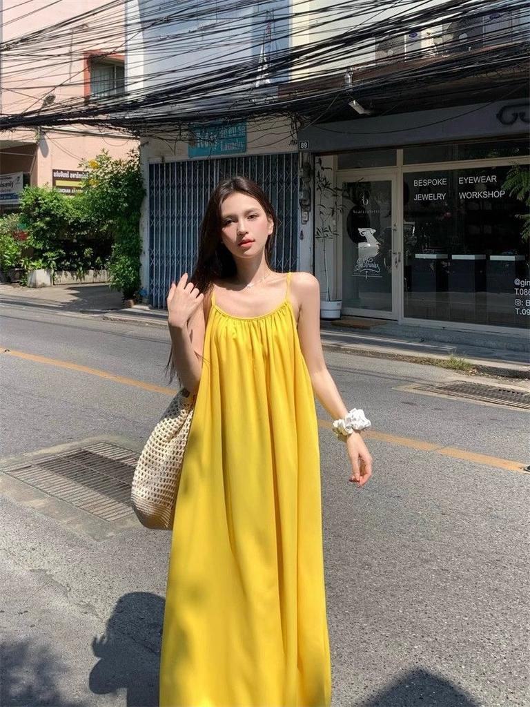 Seaside vacation sexy backless suspender dress women's summer new loose a-word skirt gentle yellow long skirt