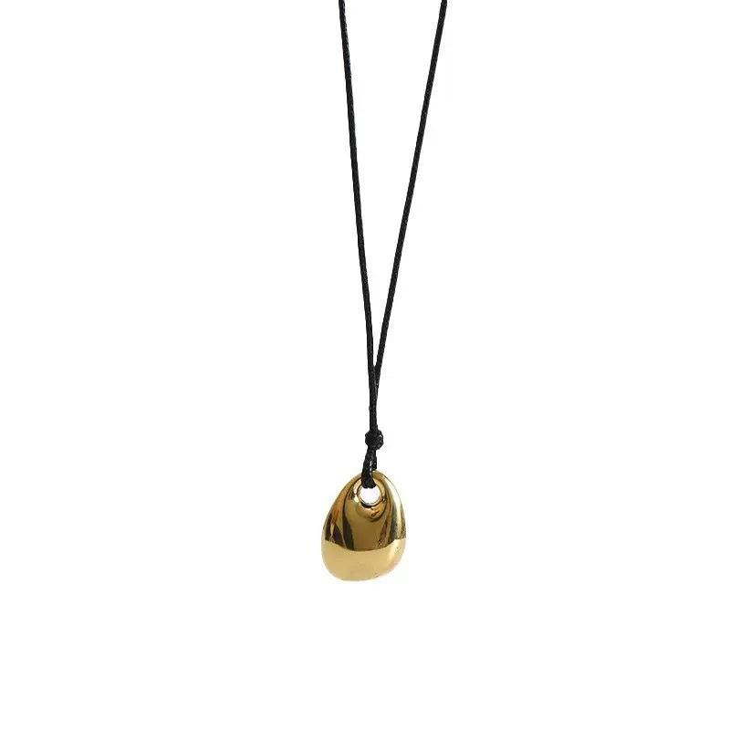 European and American Alloy New Sweater Chain Naza Gold Bean Black Leather Rope Necklace Simple and Versatile Accessories