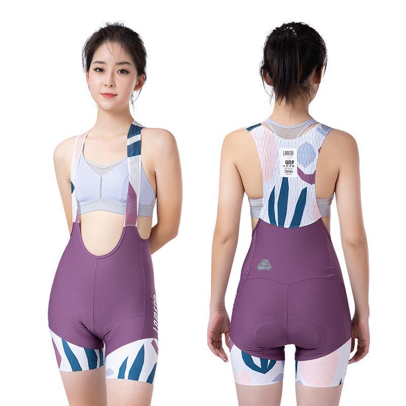 

Женские велосипедные шорты Lampa с защитой от УФ-лучей и двойными лямками EI Arrow - летние шоссейные велосипедные шорты с принтом перьев. Large мальвовый/фиолетовый