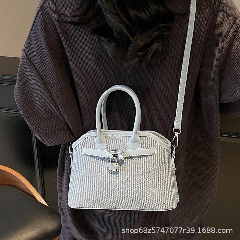 2025 new niche simple casual bucket bag women's one-shoulder crossbody bag cute retro hand-held shell bag