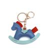 Cartoon Rocking Horse Keychain: Creative PU Leather Pony Charm with Cotton Filling.