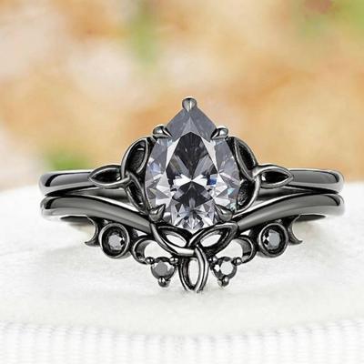 Luxuriöser europäischer und amerikanischer neuer eingelegter Wassertropfen-Zirkonring, gun-schwarz galvanisierter Damen-Klee-Blumen-Partnerring