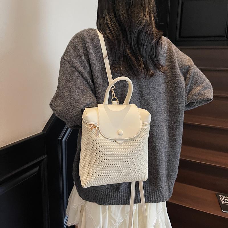 Summer straw bag women's new contrasting color backpack niche hollow woven portable backpack