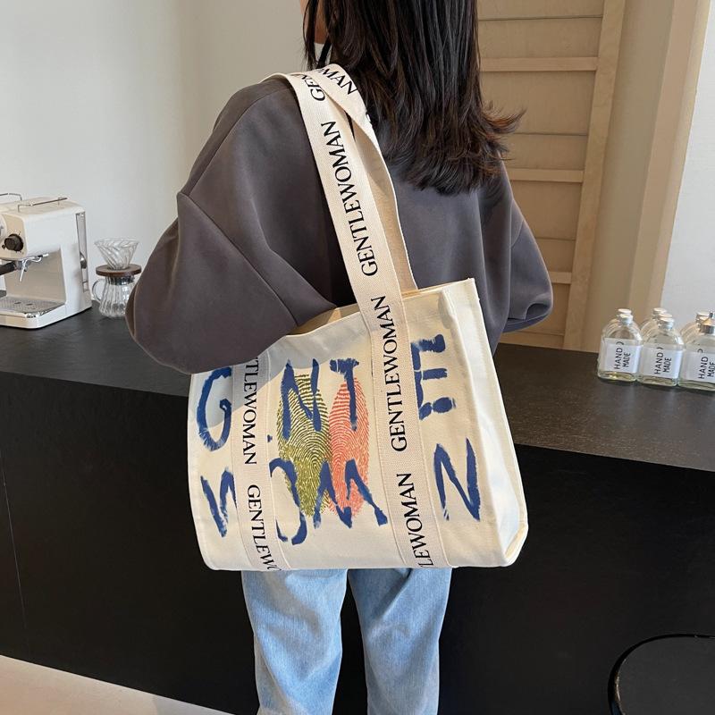Commuter large-capacity alphabet canvas bag women's new fashion college student shoulder tote bag portable leisure bag