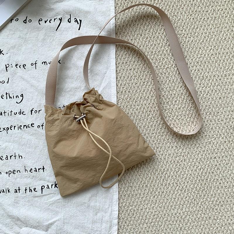 

Korean Style Ins Personalized Casual Drawstring Nylon Cross-body Small Bag Women s All-matching Simple Lightweight Mini One-shoulder Cloth абрикосовый