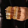 Dubai Bestseller: Exquisite Rhinestone-Studded NK Chain Bracelet with Day-Character Buckle, 18k Gold-Plated Titanium Steel, Light Luxury Style.
