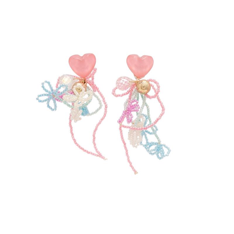 Boucles d'oreilles bohèmes roses à fleurs de perles de rocaille et pompons de perles