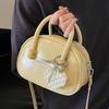 Korean version of the hot-selling cream style portable bowling bag, girls' fashion and advanced sense, foreign style versatile simple messenger bag