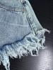 Shorts en jean déchirés taille haute à franges pour femmes style européen et américain 2024