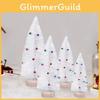 Whimsical White Christmas Tree With Bells And Snowy Finish Perfect For Holiday Table Decor