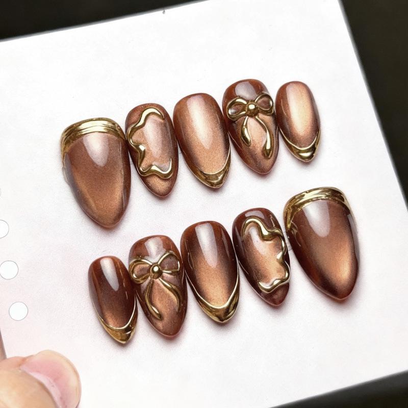 30-Piece Set of Gold-Plated Cat Eye Almond Nails with 3D Bow Design
