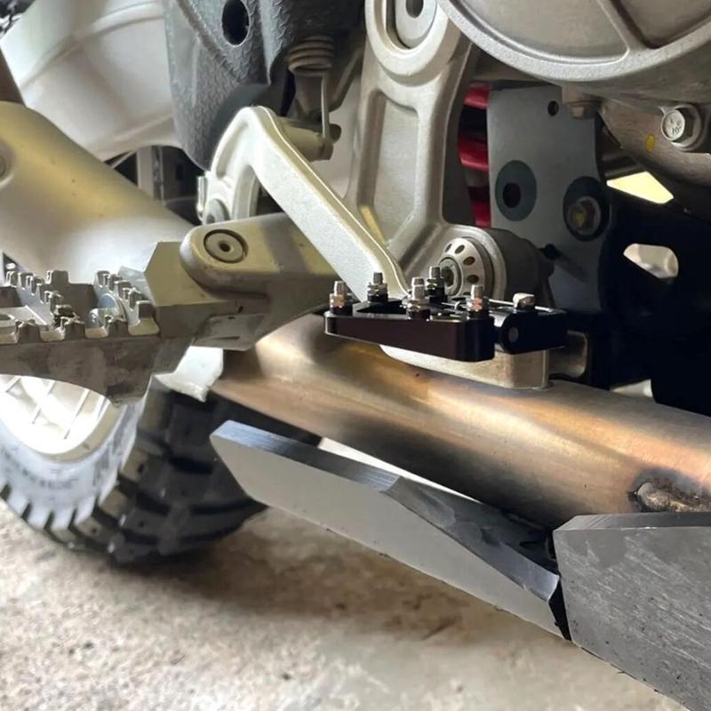 Metal-Pin Motorcycle Brake Toe Tip with Pivoting Spring Hinge, Aluminum Body, and an Elongated Slotted Attachment Section
