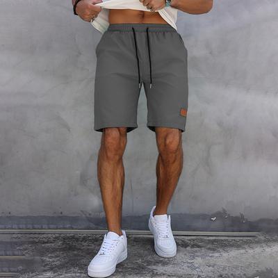 Short d'été décontracté pour homme, pantalon cinq-quarts classique, couleur unie, cordon de serrage, étiquette en cuir