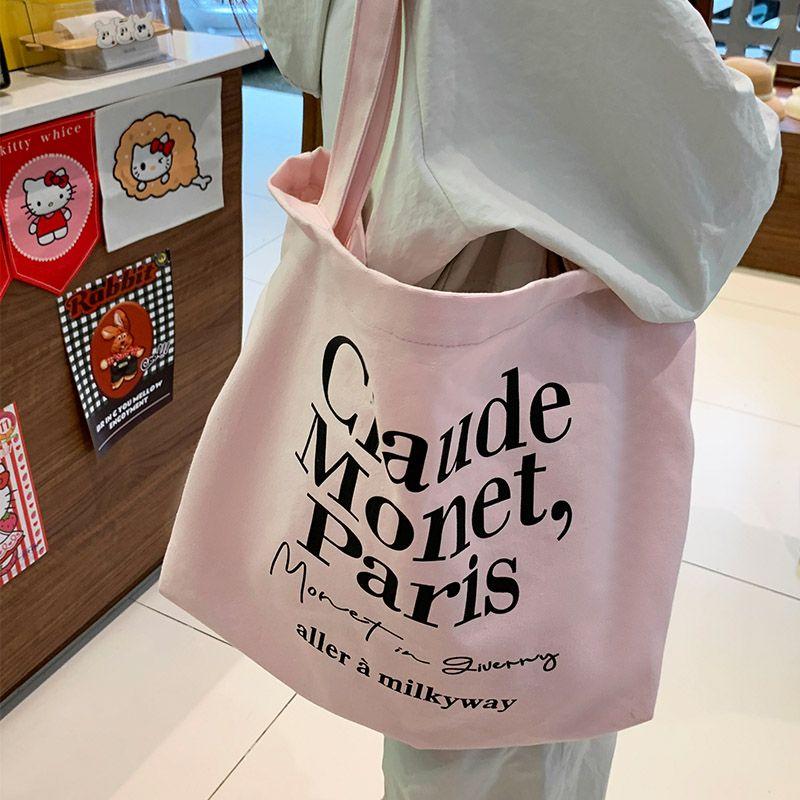 

South Korea Minimalist Pink with Letters Canvas Bag Female 2025 New Arrival Fashion Tote Bag Large Capacity Commuter Shoulder Bag Pink Bag