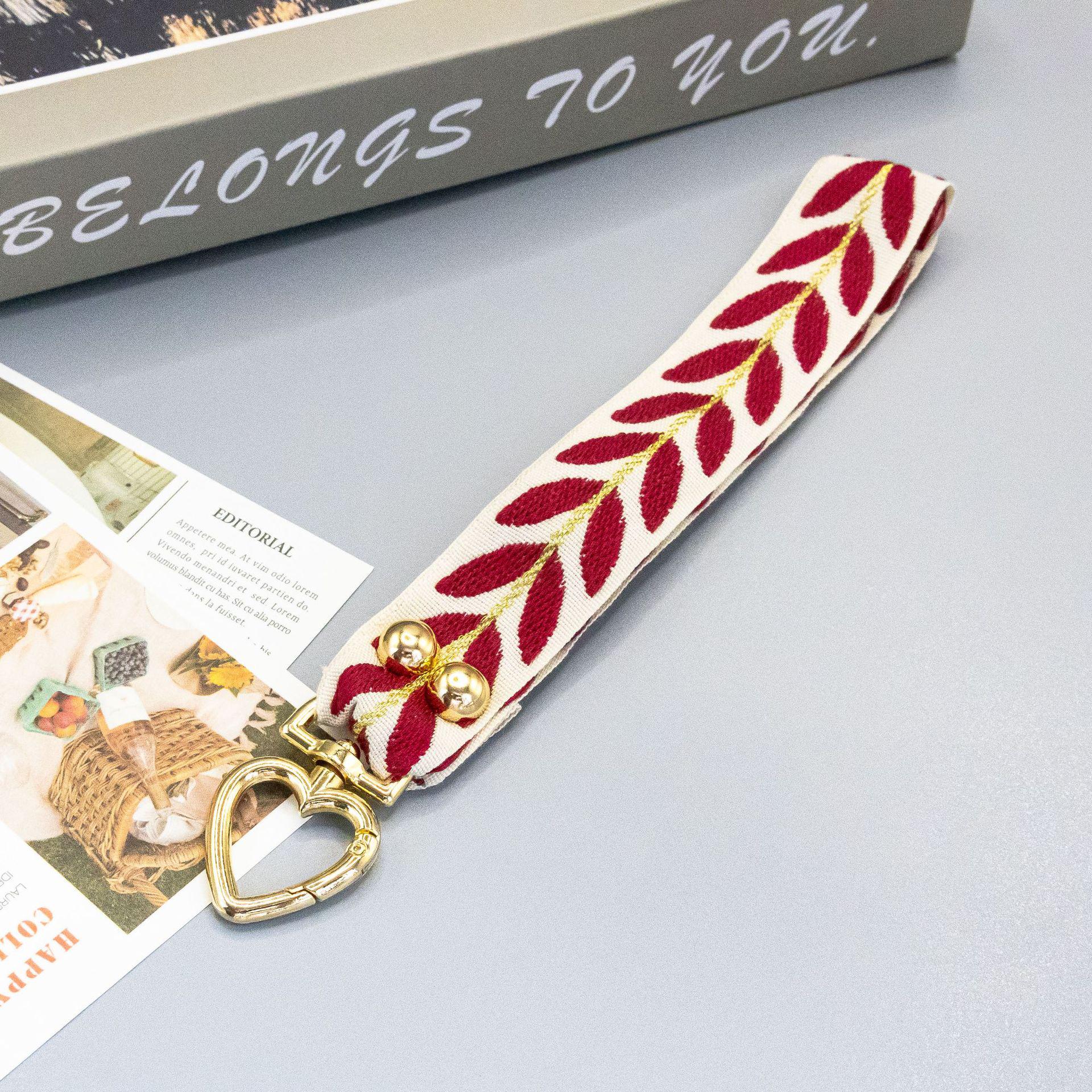 

Maple Leaf Phone Lanyard: Adjustable Crossbody Chain with Pearl Charm - Anti-Lost and Sturdy Design