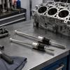 Stem Seal Replacement Tool with Threaded Rod and Contact Face for Controlling Crankshaft Position During Service