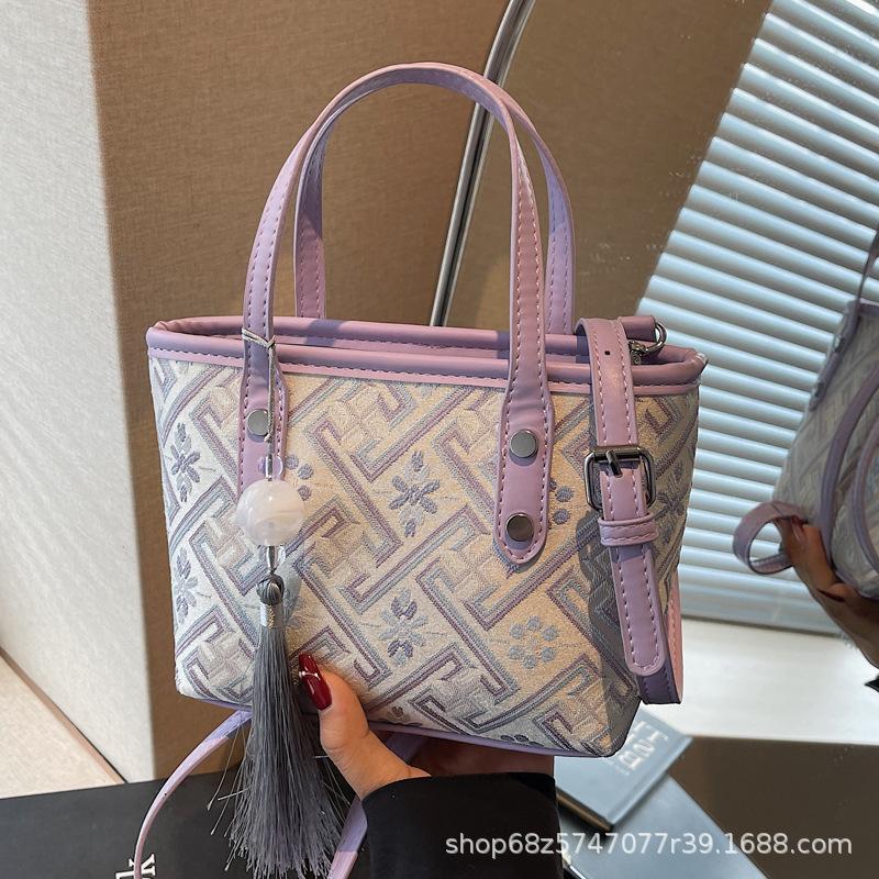 Niche design small bag women's 2025 new foreign style fashion portable bucket cloth bag women's commuter shoulder messenger bag