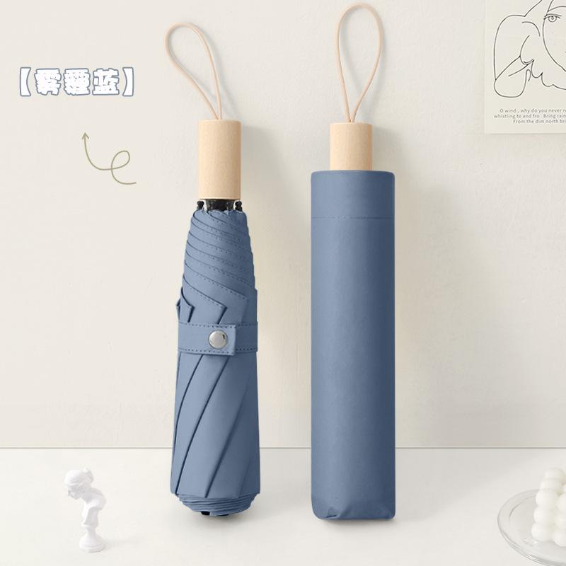 New three-fold simple plain color windproof and sun protection creative solid wood handle female vinyl parasol