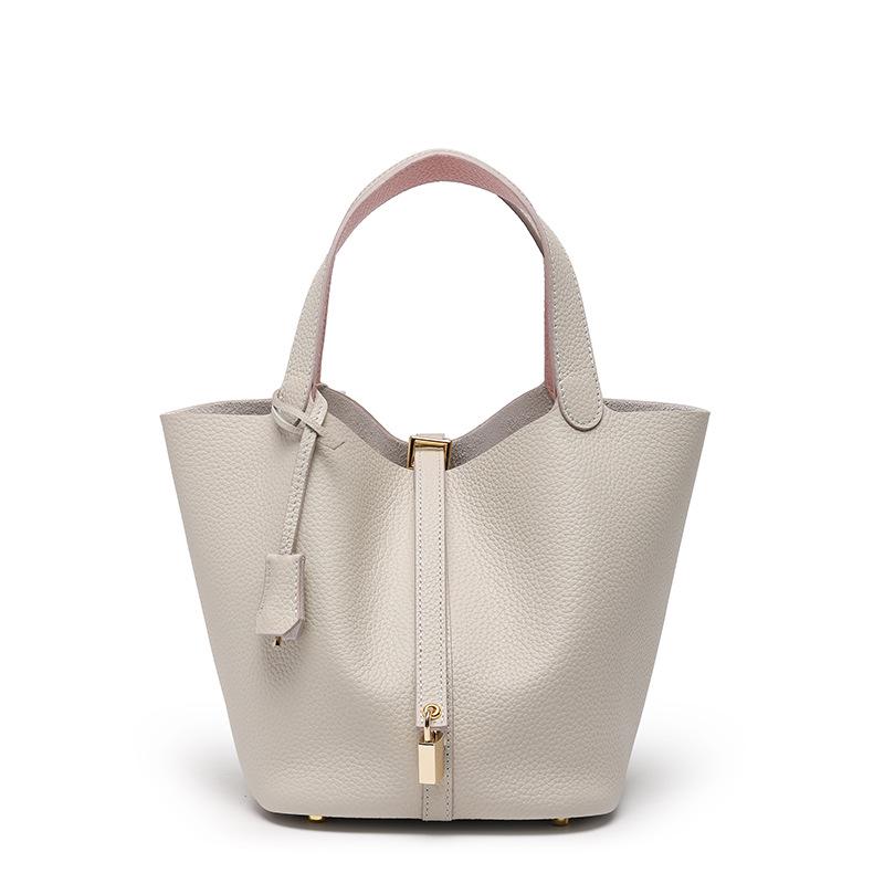 

Жіноча сумка-відро зі шкіри корови: Маленький, універсальний, преміальний для роботи або поїздок