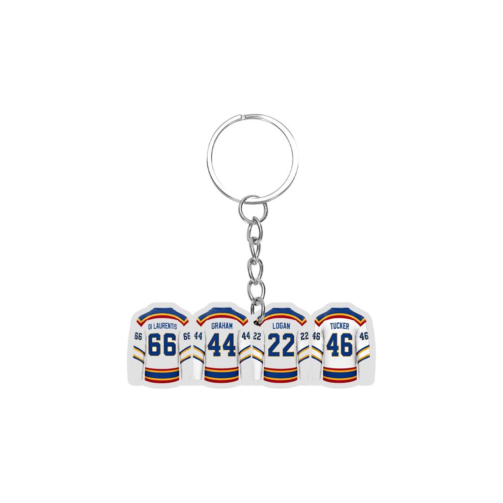 Acrylic Keychain Featuring Four Ice Hockey Players Standing Side by Side Wearing Numbered Jerseys with Attached Metal Key Ring for Easy Carrying