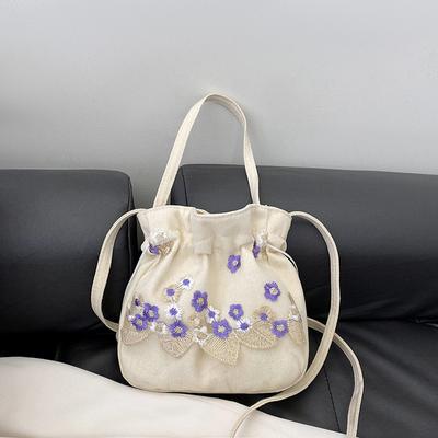 2024 Neue einfache Nylon bestickte Blume tragbare Pendler Eimer Tasche Guofeng Schulter Messenger Bag