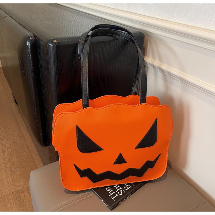 

Halloween pumpkin bag girl 2025 new niche design sense tote bag large capacity versatile shoulder armpit bag помаранчевий