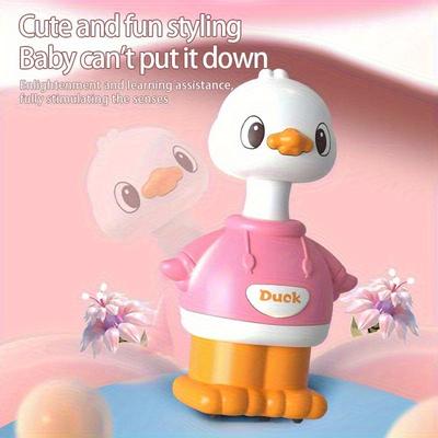 A Cartoon-shaped Sliding Toy, a Little Yellow Duck, That Bounces Back When the Youngsters Pushes It.